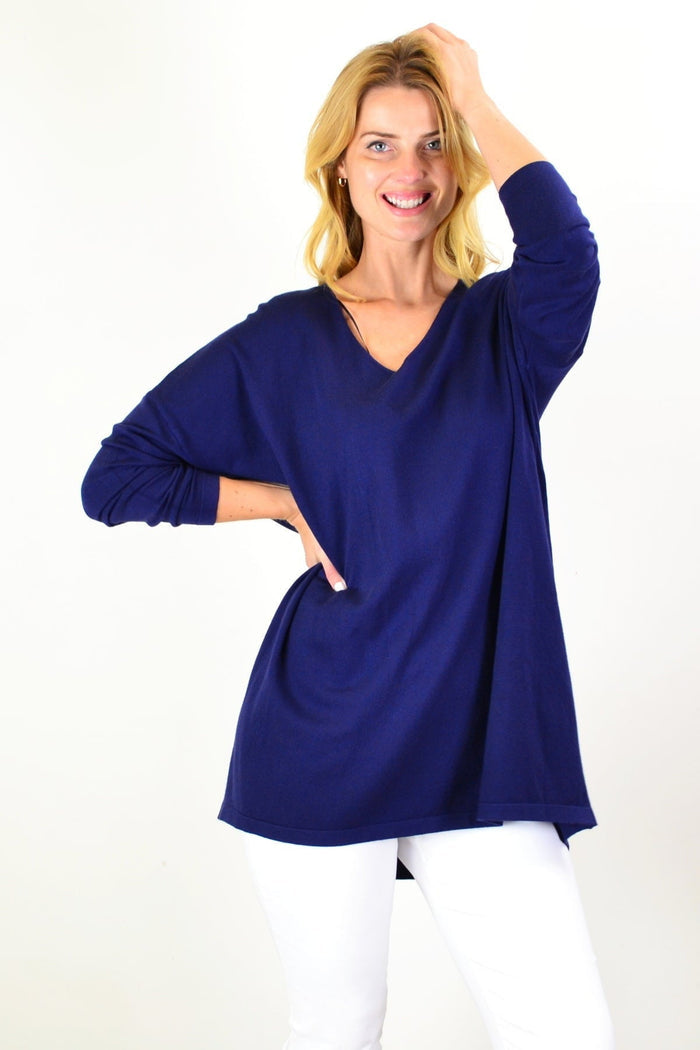 Navy blue wool blend fine knit tunic top by Cali&Co, displayed on a mannequin with a relaxed fit and long sleeves.