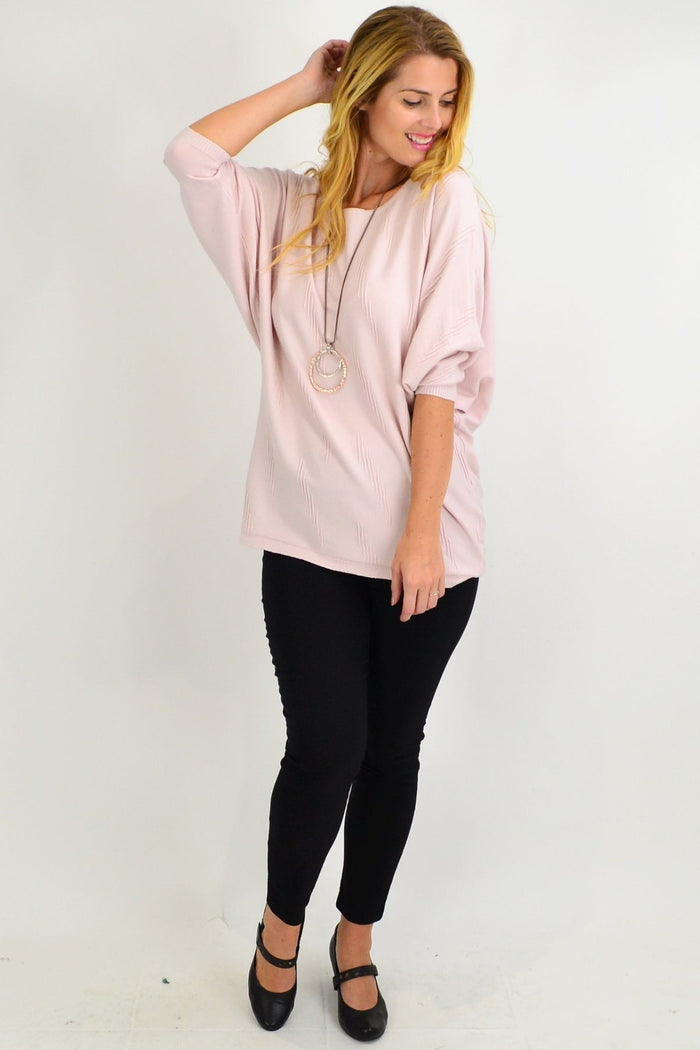 Pink batwing winter knit tunic by Cali&Co featuring a soft, cozy fabric and loose fit, perfect for cold weather.