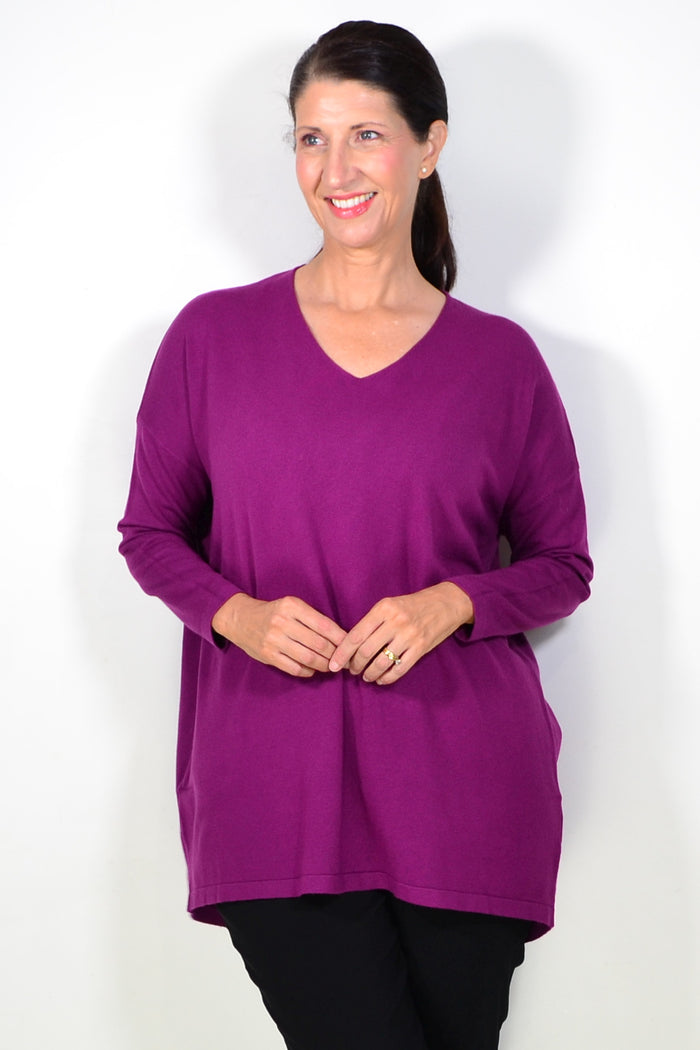 Cali&Co plum wine wool blend fine knit tunic top displayed on a hanger, showcasing its cozy, fitted design and soft texture.