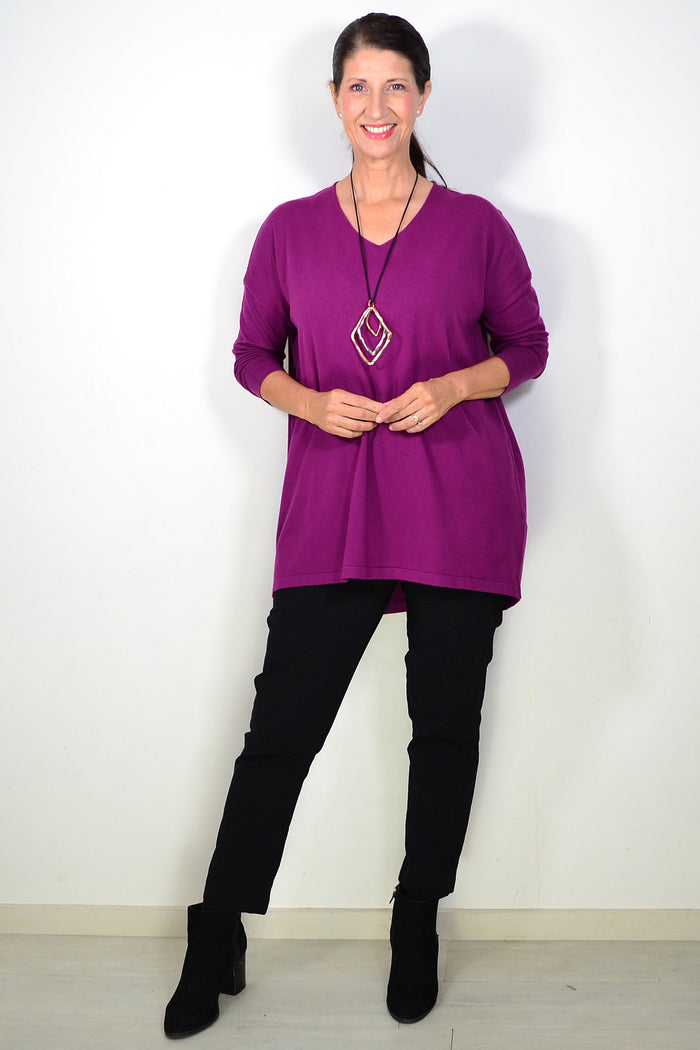 Plum-colored wool blend knit tunic top by Cali&Co, featuring a cozy, fine-knit design and relaxed fit, displayed on a hanger.
