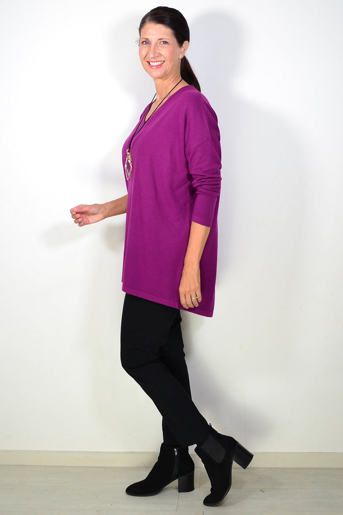 Plum wine-colored wool blend knit tunic top by Cali&Co, shown on a hanger with a relaxed fit and fine knitted texture.