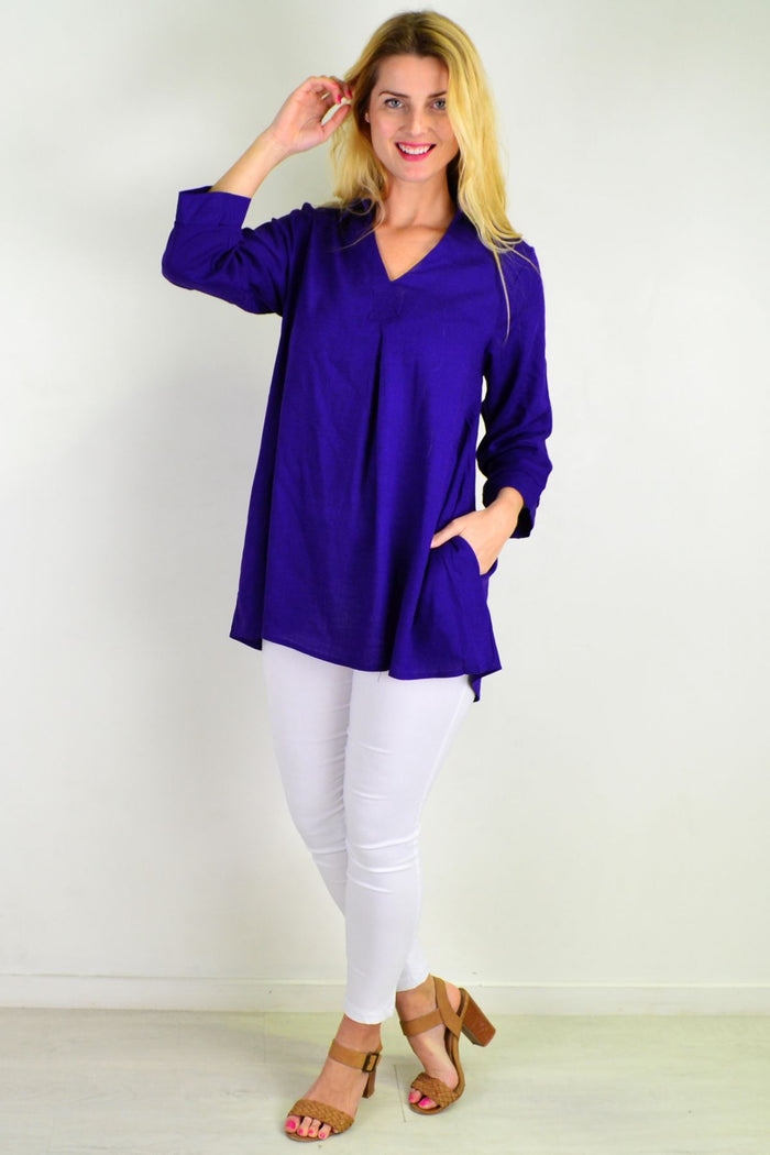 Purple pocket linen cotton tunic top by Ruby Rain, featuring a relaxed fit and short sleeves, displayed on a hanger.