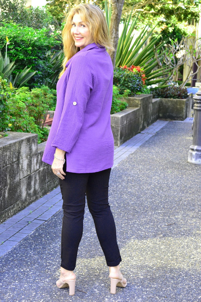 Purple rolled neck coconut button tunic top by Ruby Rain, featuring a relaxed fit and stylish design, shown on a model.