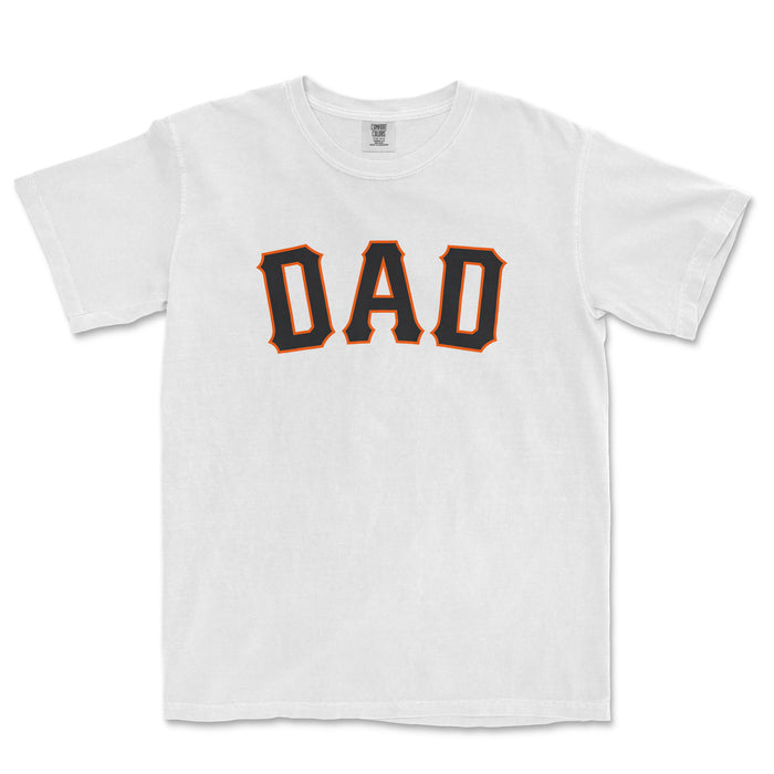 White T-shirt with "DAD" printed in bold, black letters outlined in orange, representing a San Francisco baseball dad.
