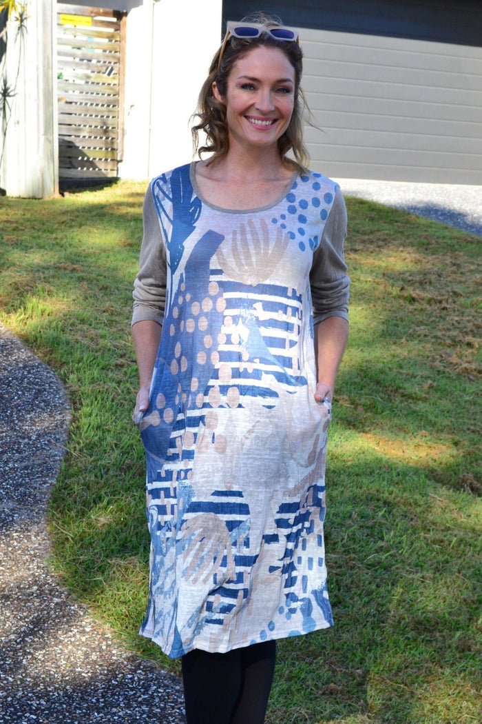 Sea Side Crinkle Tunic Dress by Cafe Latte, lightweight and flowy tunic with a crinkle fabric design, displayed hanging.