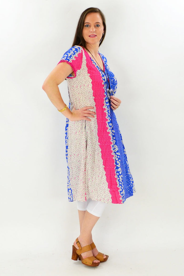 Cafe Latte Shellies Tunic Dress in soft fabric, featuring a relaxed fit and stylish design, displayed on a hanger.