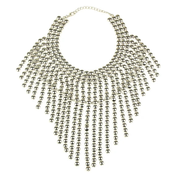 Silver statement necklace with cascading bead fringe in a wide collar silhouette.