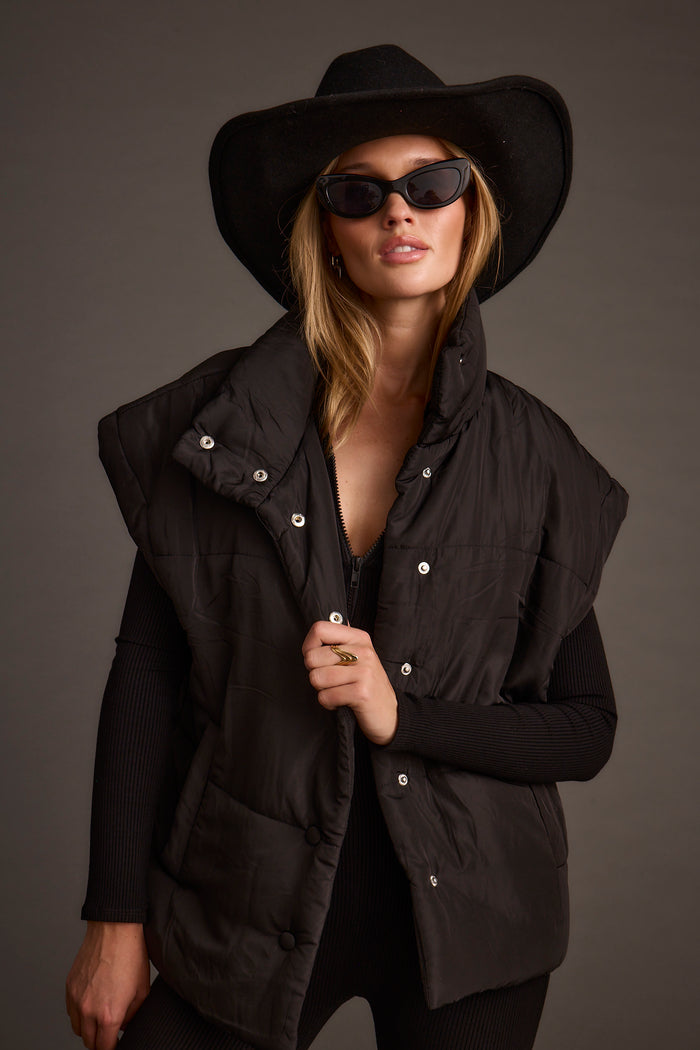 Summit Black Puffer Vest paired with complementary accessories for a polished look.
