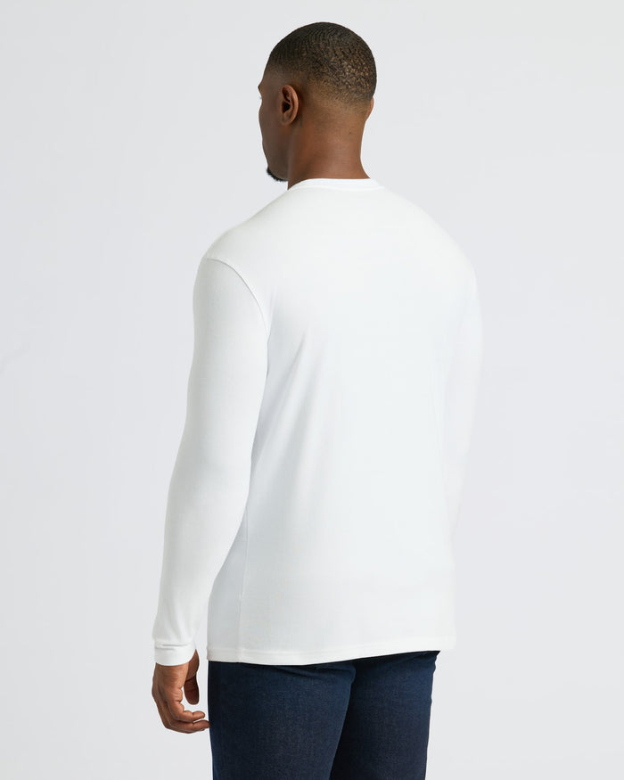 Back view of man in White Tall Heavyweight Long Sleeve Pocket Crew.