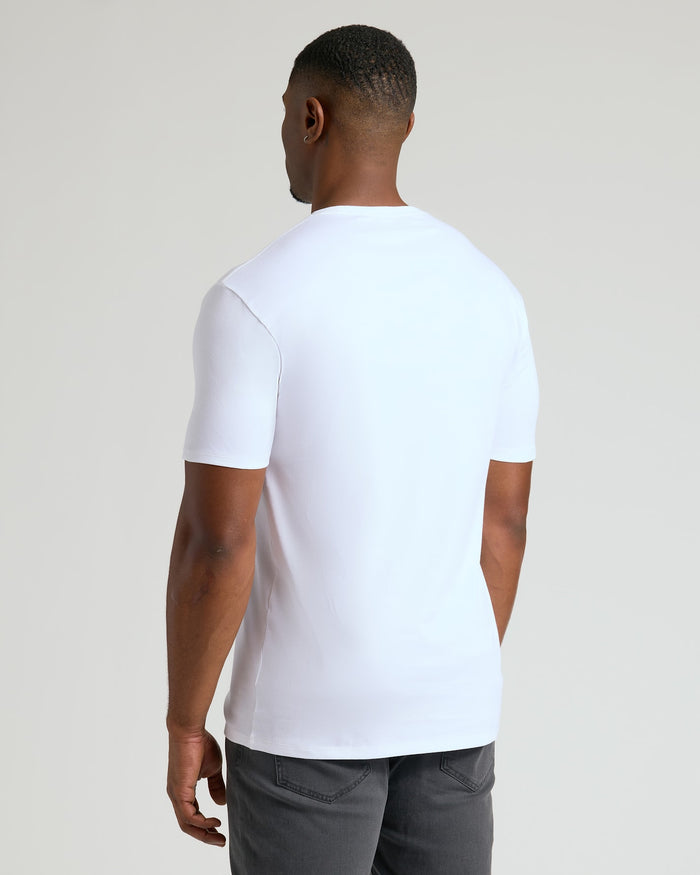Man wearing a white Tall Pima Cotton Blend Crew 4-Pack T-shirt shown from the back, highlighting the smooth fabric and comfortable fit, ideal men's basics.