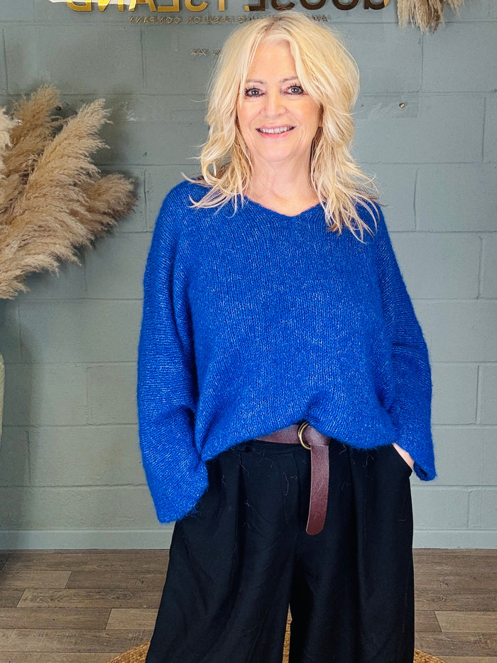 Fluffy V-Neck Alpaca Blend Jumper
The cosy, cloud soft knit you’ll reach for on repeat – slouchy, flattering and effortlessly chic.

Why you’ll love it:

Super soft fluffy knit with a luxe alpaca blend feel
Easy V-neckline – perfect for layering over vests, tees or a shirt
Relaxed, oversized fit for that thrown-on-and-go vibe
Lightweight warmth (cosy without feeling bulky)
Available in 4 colours

Fit &amp; Sizing:
Free size – fits comfortably up to a UK 18 (slouchy/oversized style).

Measurement