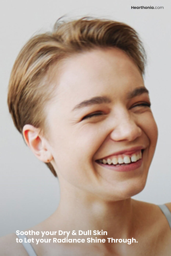 Smiling young woman showcasing how Druide Biolove Organic Witch Hazel Toner let's her radiance shine through.