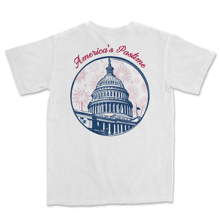 White t-shirt featuring a graphic of the U.S. Capitol dome with "America's Pastime" text and fireworks design.